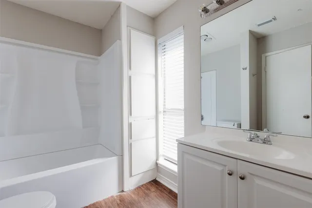 a bathroom with a sink a toilet and a bathtub