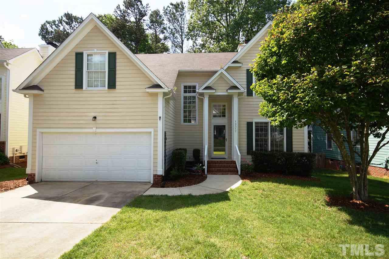 12317 Hartwick Court Raleigh, NC 27613 - Photo 1 of 24 a view of house with a yard