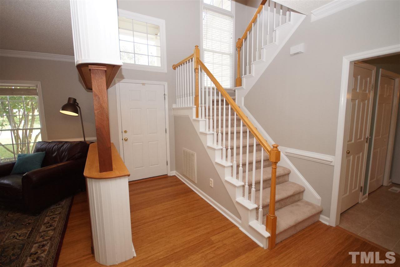 12317 Hartwick Court Raleigh, NC 27613 - Photo 2 of 24 a view of entryway and hall with wooden floor