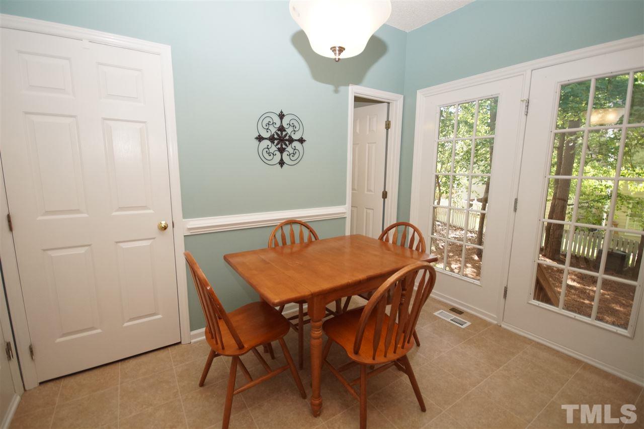 12317 Hartwick Court Raleigh, NC 27613 - Photo 11 of 24 a dining room with furniture and window