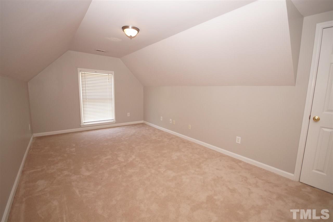 12317 Hartwick Court Raleigh, NC 27613 - Photo 16 of 24 an empty room with windows and closet
