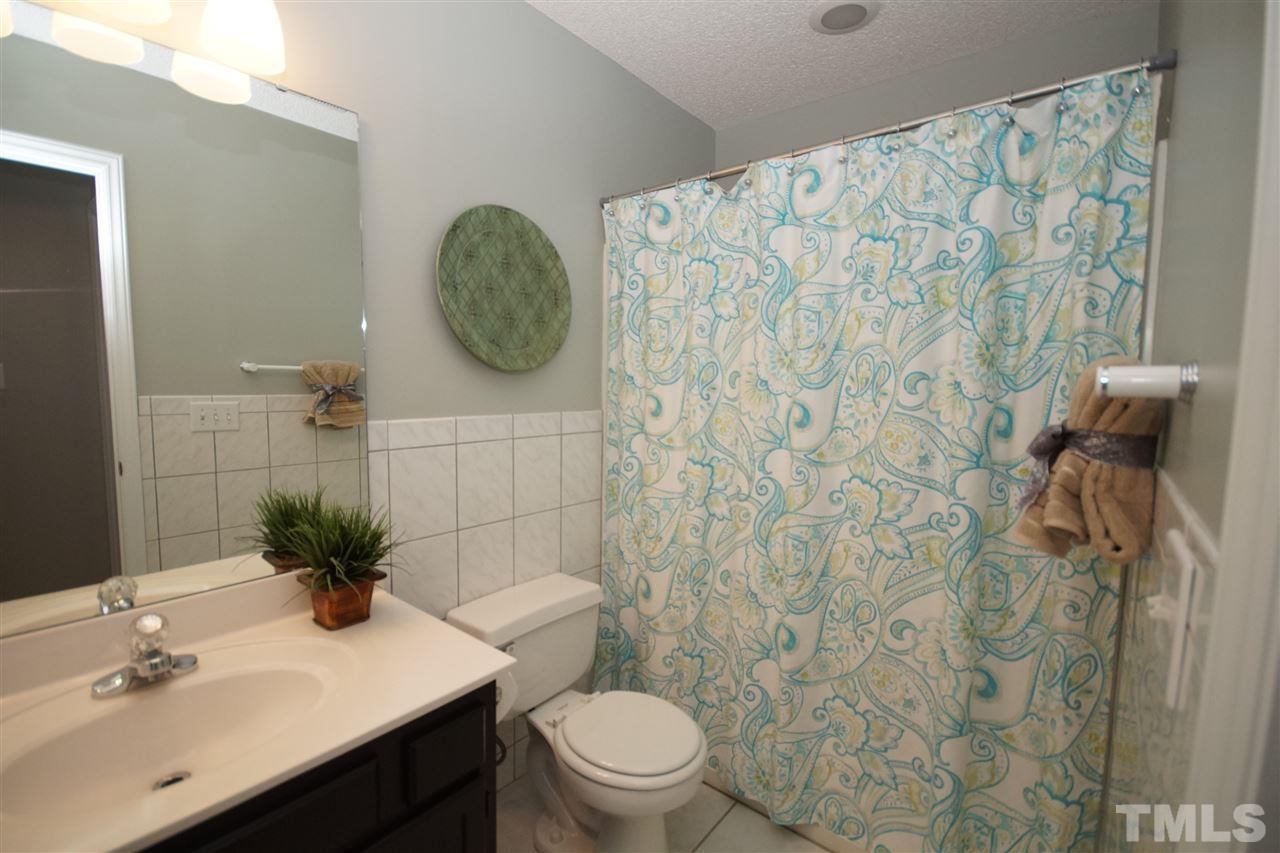 12317 Hartwick Court Raleigh, NC 27613 - Photo 17 of 24 a bathroom with a toilet and a sink