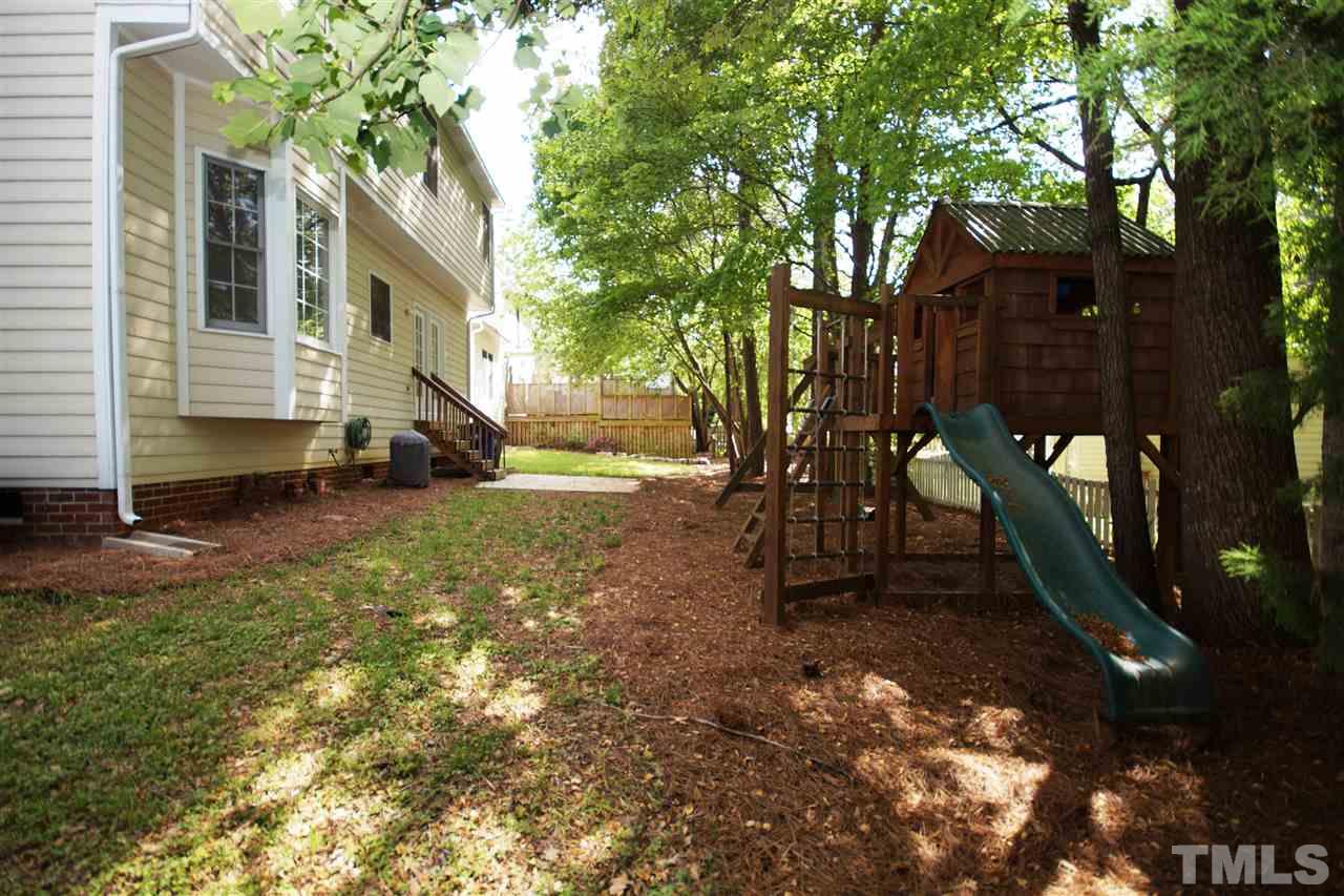 12317 Hartwick Court Raleigh, NC 27613 - Photo 20 of 24 a view of a house with a yard