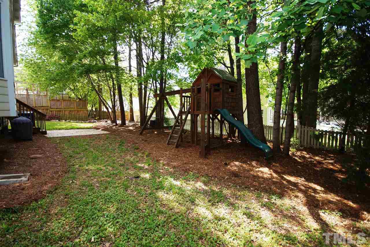 12317 Hartwick Court Raleigh, NC 27613 - Photo 21 of 24 a view of a tree in the middle of a yard