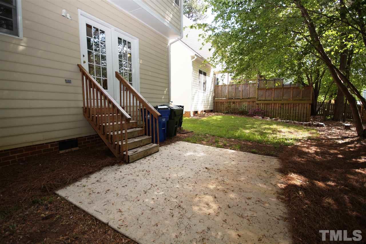 12317 Hartwick Court Raleigh, NC 27613 - Photo 22 of 24 a view of a house with backyard and trees