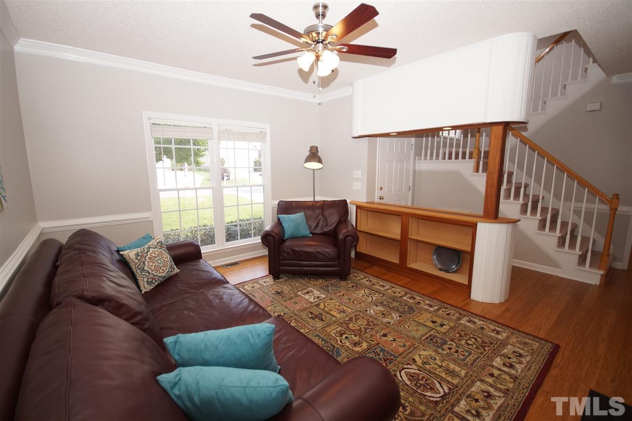 12317 Hartwick Court Raleigh, NC 27613 - Photo 7 of 24 a living room with furniture and a rug