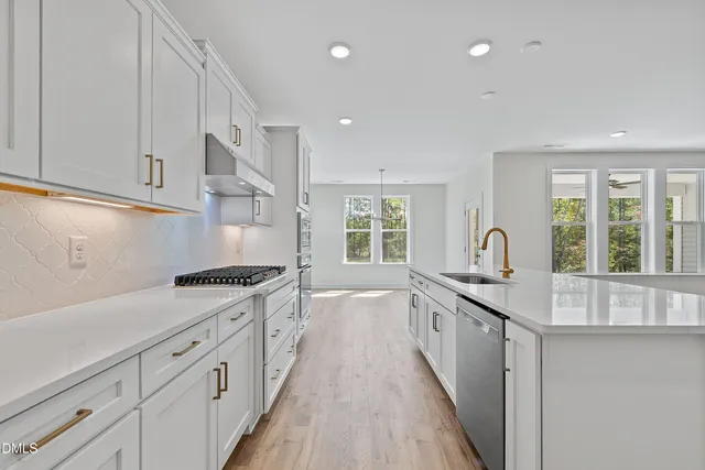 a white bath tub sitting next to a shower