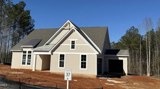 a view of house with yard