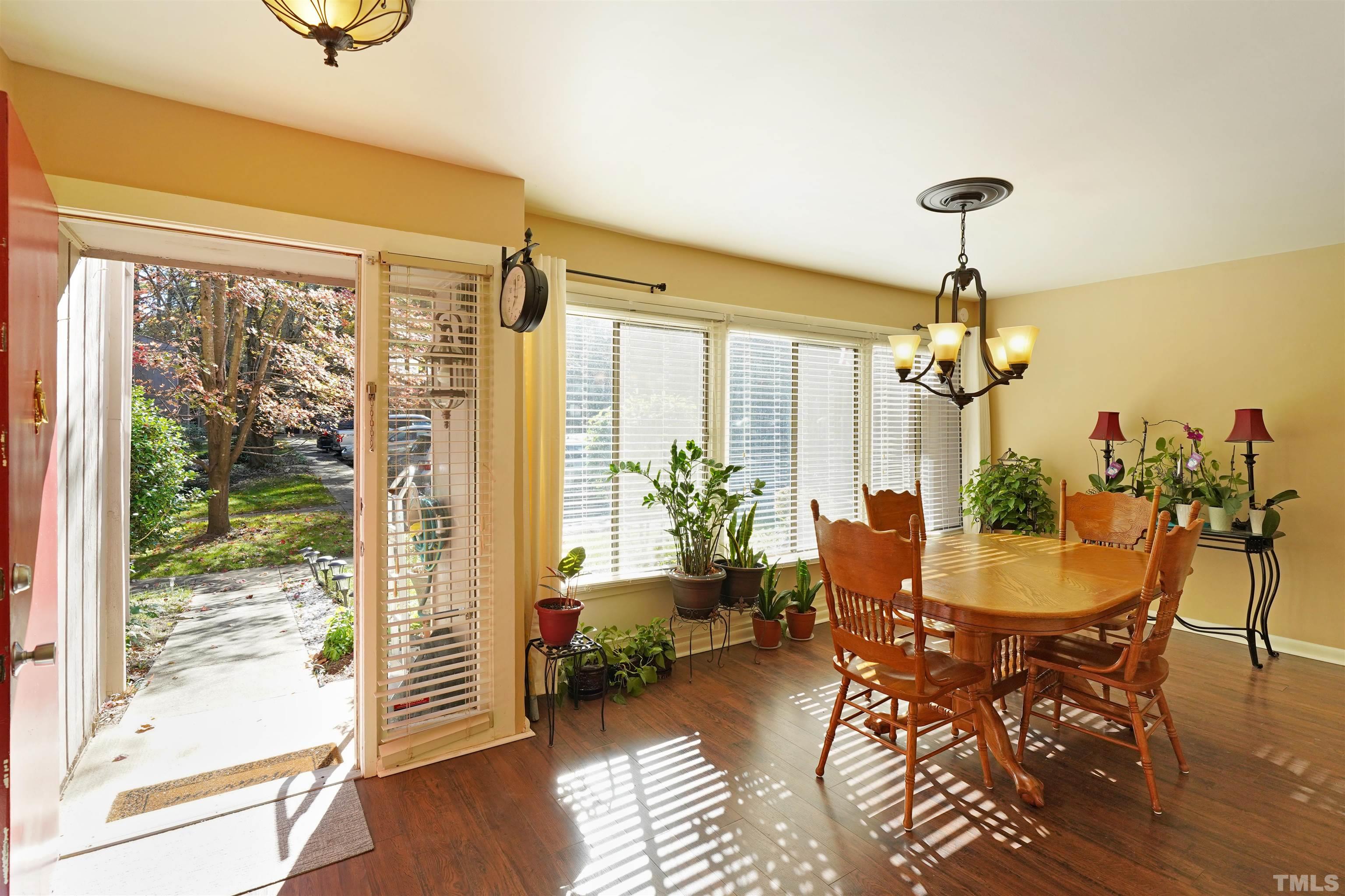 1738 Quail Ridge Road Raleigh, NC 27609 - Photo 2 of 13 a view of a dining room with furniture window and wooden floor