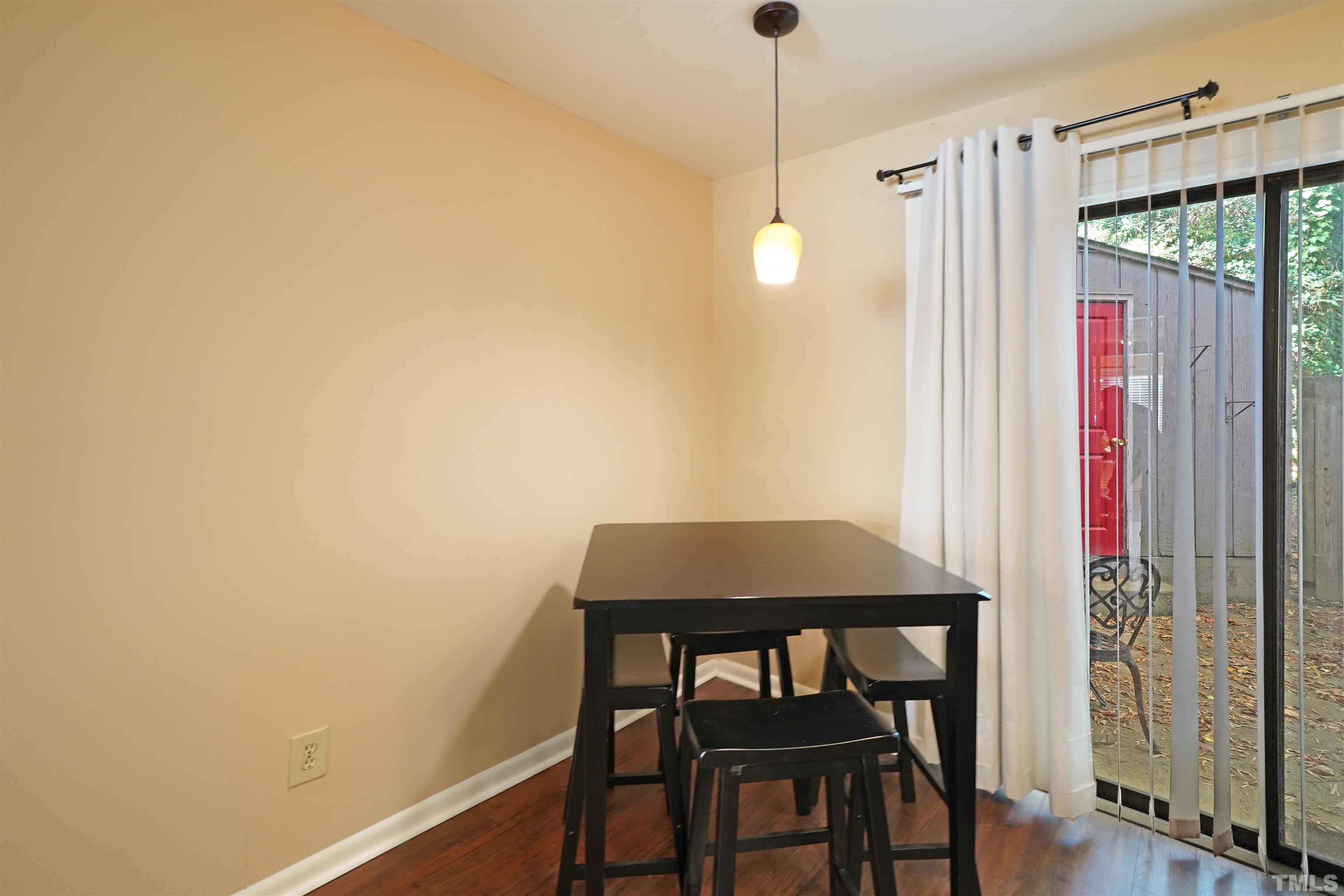 1738 Quail Ridge Road Raleigh, NC 27609 - Photo 5 of 13 a view of a room with a table and chairs