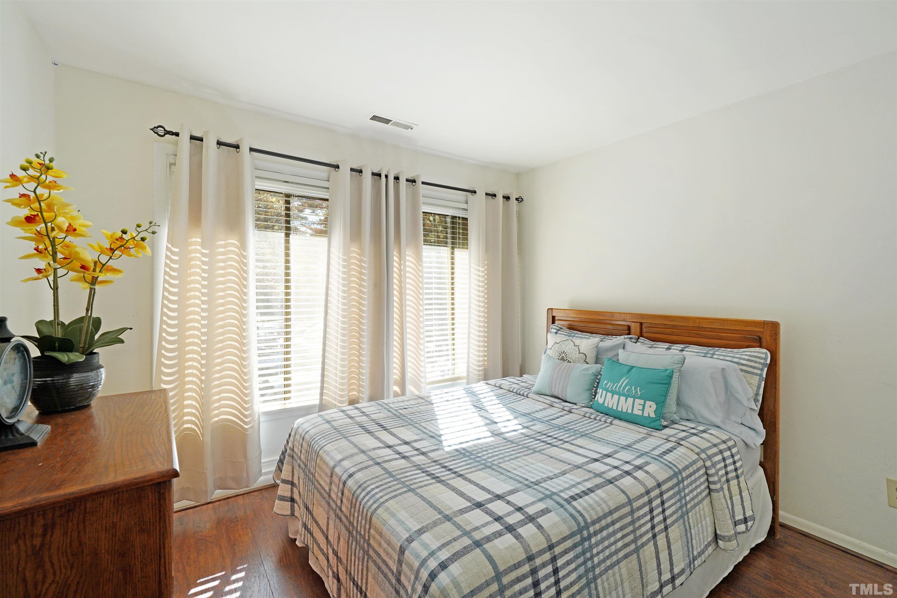 1738 Quail Ridge Road Raleigh, NC 27609 - Photo 9 of 13 a bedroom with a bed and a window