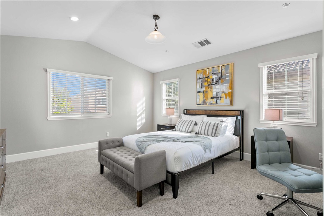 1746 Agrigento Avenue Riverside, CA 92507 - Photo 11 of 22 a bedroom with a bed couch and window