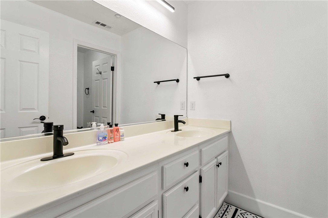 1746 Agrigento Avenue Riverside, CA 92507 - Photo 17 of 22 a bathroom with a sink and a bathtub