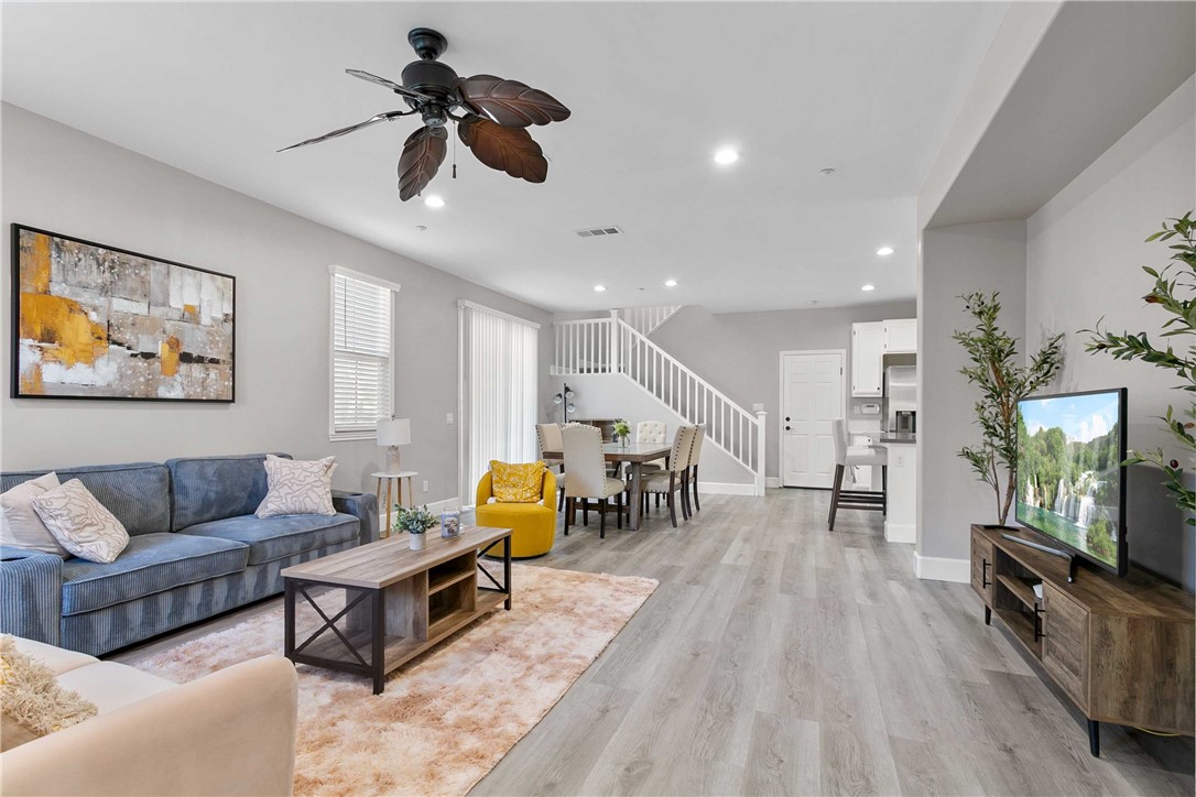 1746 Agrigento Avenue Riverside, CA 92507 - Photo 2 of 22 a living room with furniture and a flat screen tv