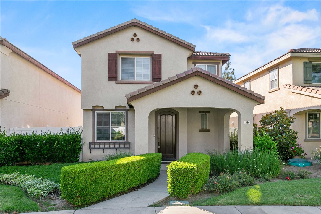 1746 Agrigento Avenue Riverside, CA 92507 - Photo 21 of 22 a front view of a house with a yard