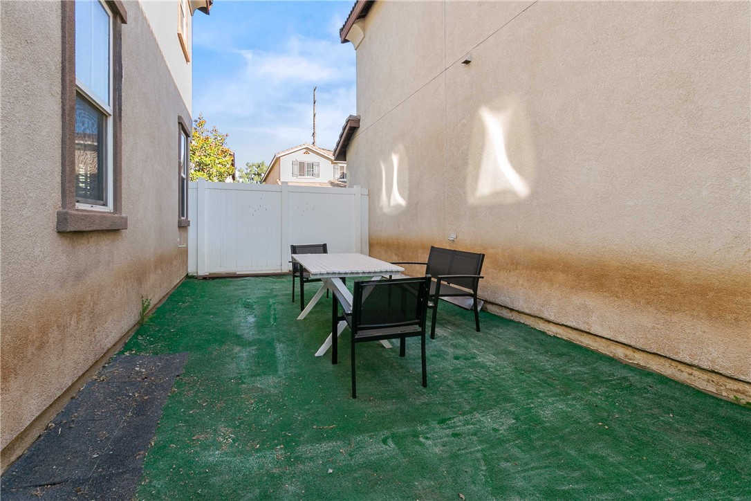 1746 Agrigento Avenue Riverside, CA 92507 - Photo 22 of 22 a backyard of a house with table and chairs
