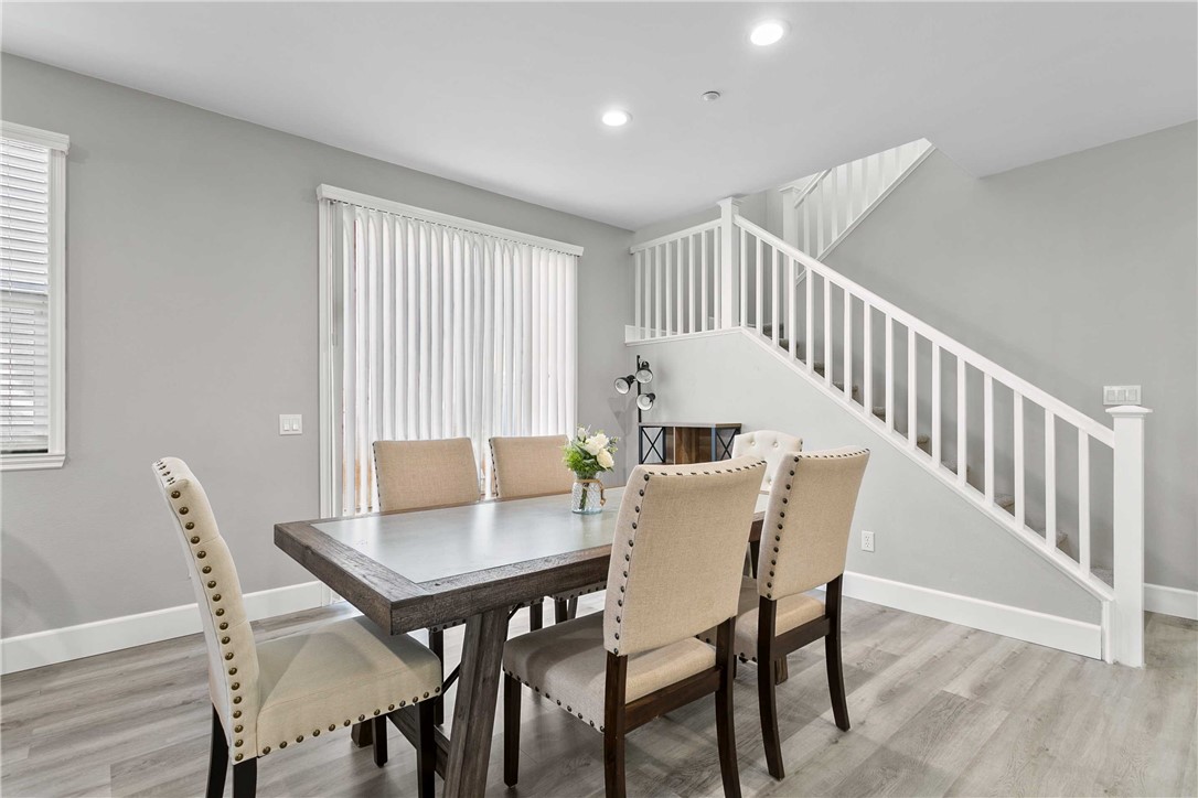 1746 Agrigento Avenue Riverside, CA 92507 - Photo 4 of 22 a view of a dining room with furniture and wooden floor