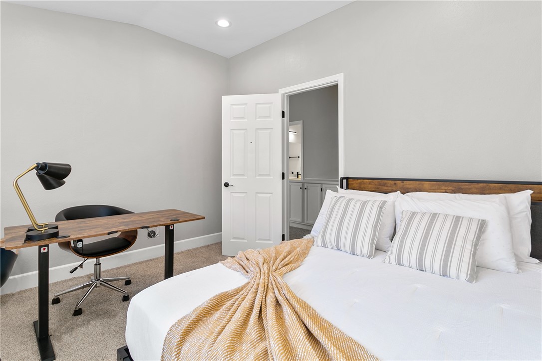 1746 Agrigento Avenue Riverside, CA 92507 - Photo 8 of 22 a bedroom with a bed and a chair