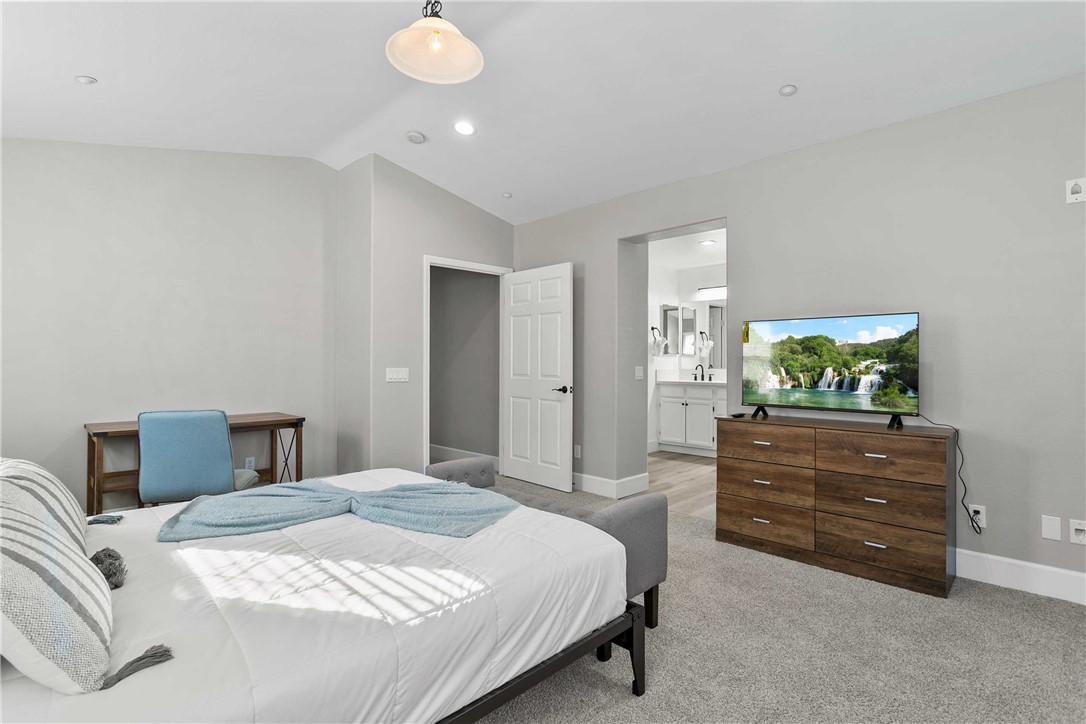 1746 Agrigento Avenue Riverside, CA 92507 - Photo 10 of 22 a bedroom with a bed and dresser