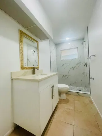 a room with a cabinets and utility room