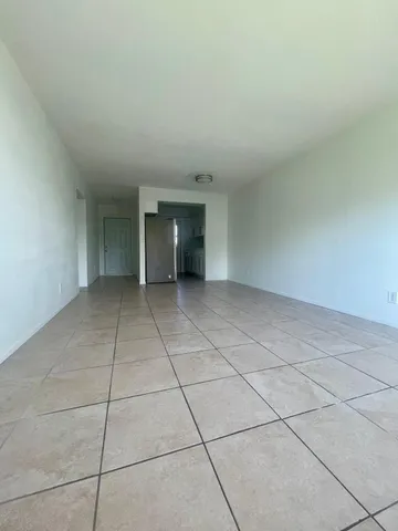 a kitchen with granite countertop a sink and steel stainless steel appliances