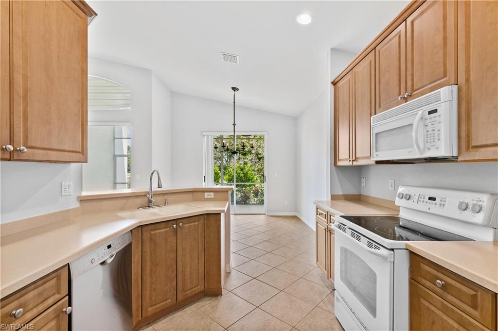 9300 Springview Loop Estero, FL 33928 - Photo 13 of 50 a kitchen with a sink cabinets and window
