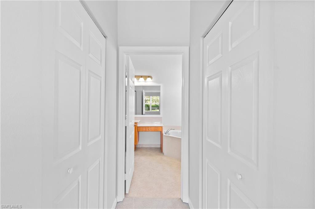9300 Springview Loop Estero, FL 33928 - Photo 17 of 50 a view of a bedroom from a hallway