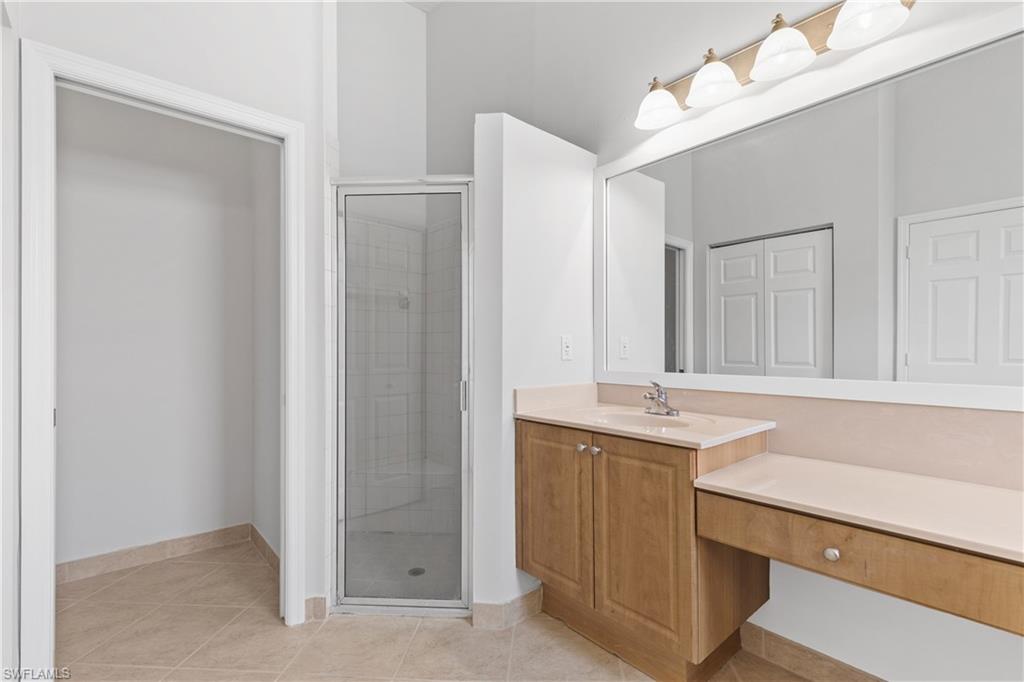 9300 Springview Loop Estero, FL 33928 - Photo 19 of 50 a bathroom with a sink and a mirror