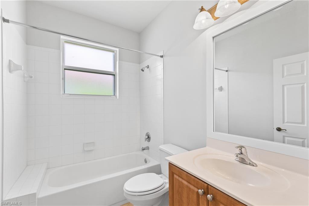 9300 Springview Loop Estero, FL 33928 - Photo 22 of 50 a bathroom with a sink a toilet and shower