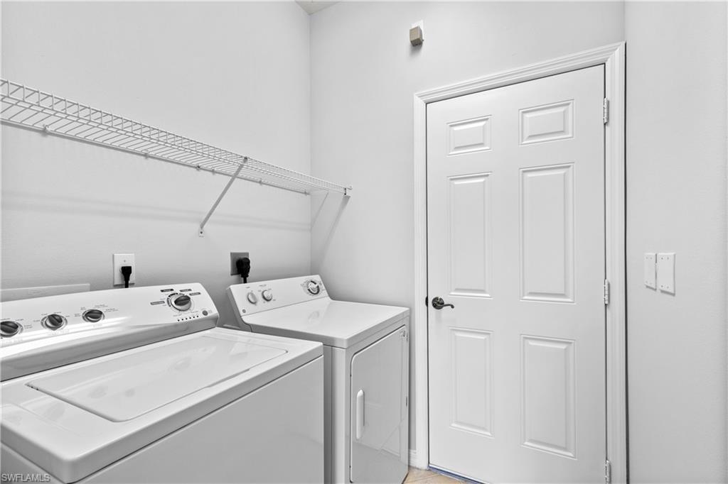 9300 Springview Loop Estero, FL 33928 - Photo 24 of 50 a utility room with dryer and washer