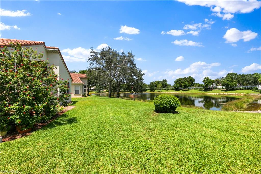 9300 Springview Loop Estero, FL 33928 - Photo 28 of 50 a lake view with a garden