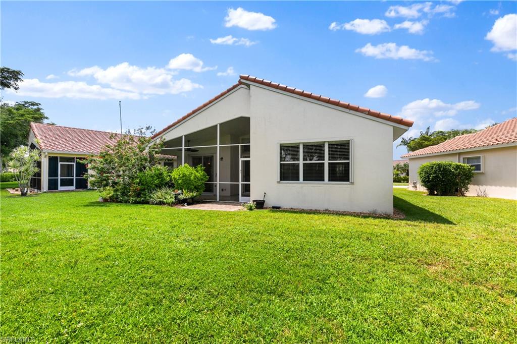9300 Springview Loop Estero, FL 33928 - Photo 30 of 50 a view of a house with backyard and garden