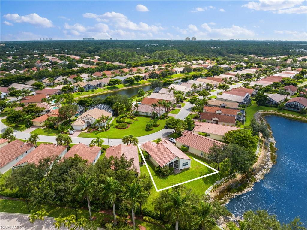 9300 Springview Loop Estero, FL 33928 - Photo 3 of 50 an aerial view of residential houses with outdoor space and garden