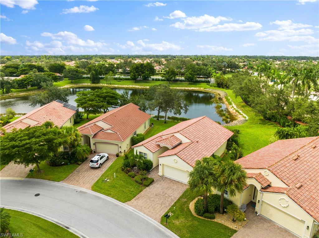 9300 Springview Loop Estero, FL 33928 - Photo 33 of 50 a view of a lake with a yard