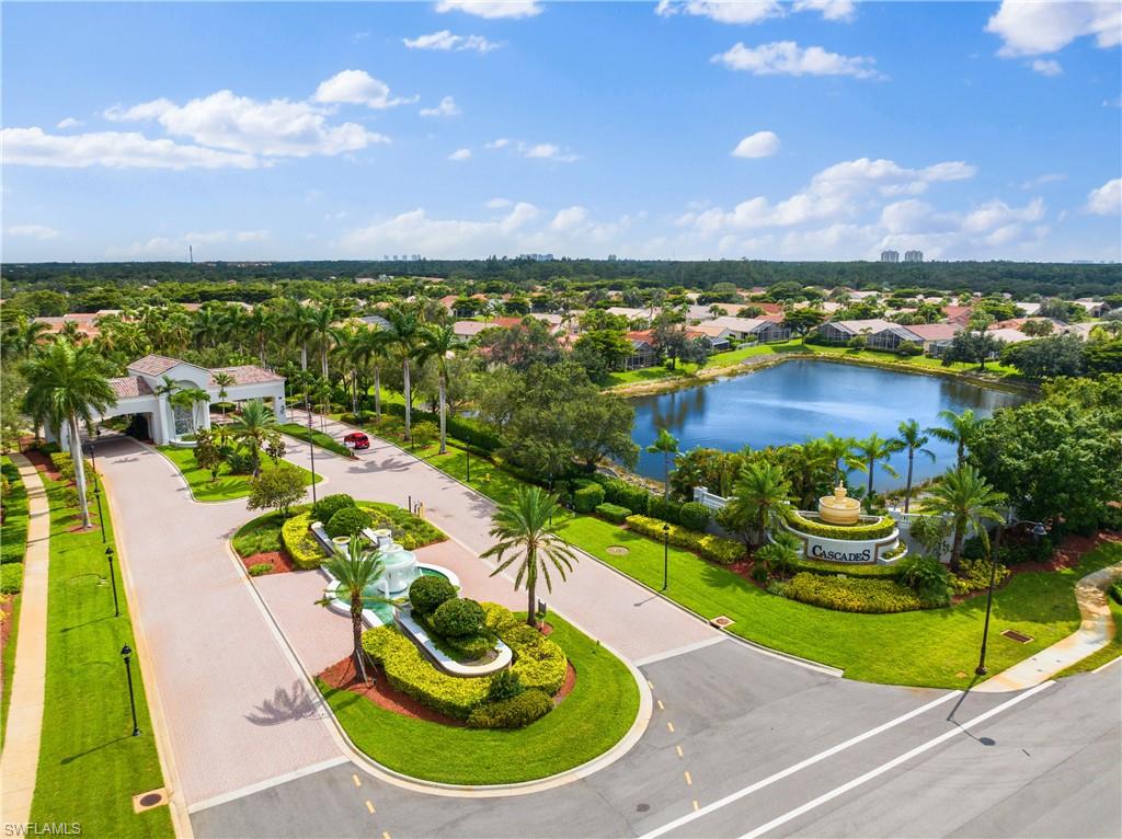 9300 Springview Loop Estero, FL 33928 - Photo 38 of 50 a view of a swimming pool with a garden