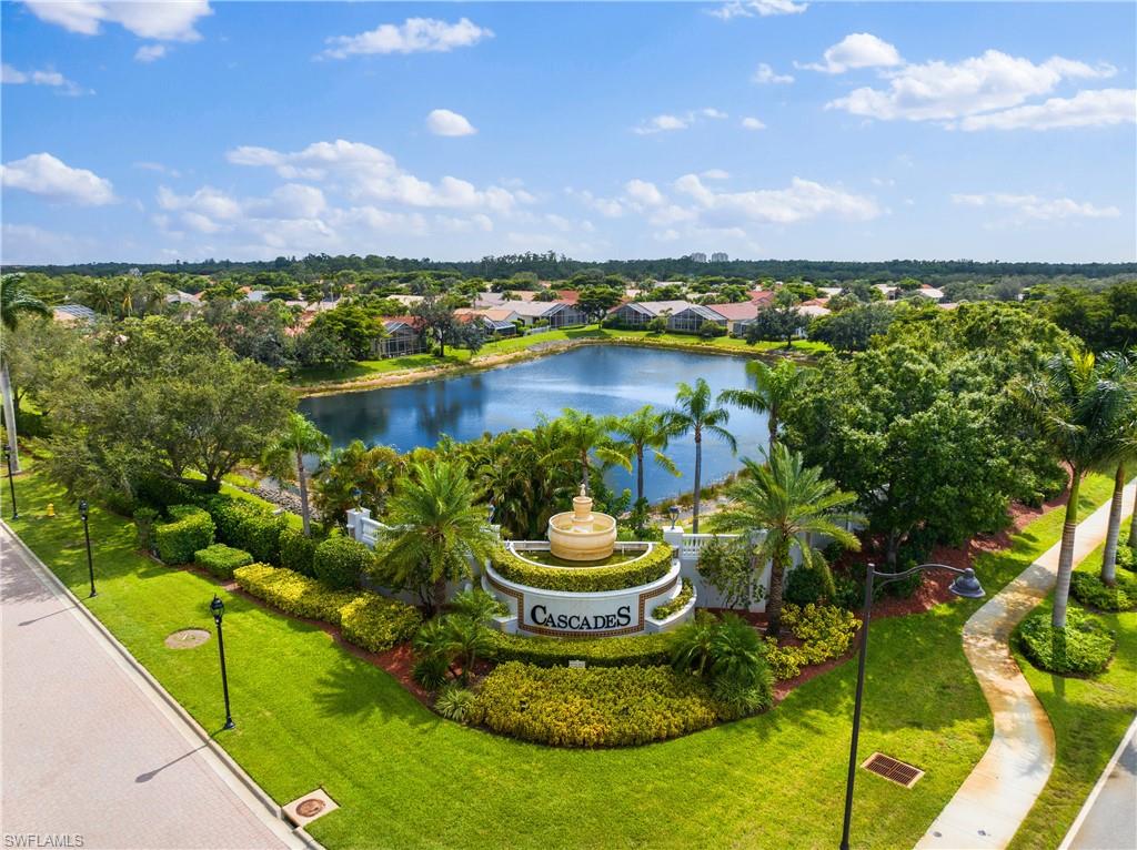9300 Springview Loop Estero, FL 33928 - Photo 39 of 50 a view of a lake with a house in the background