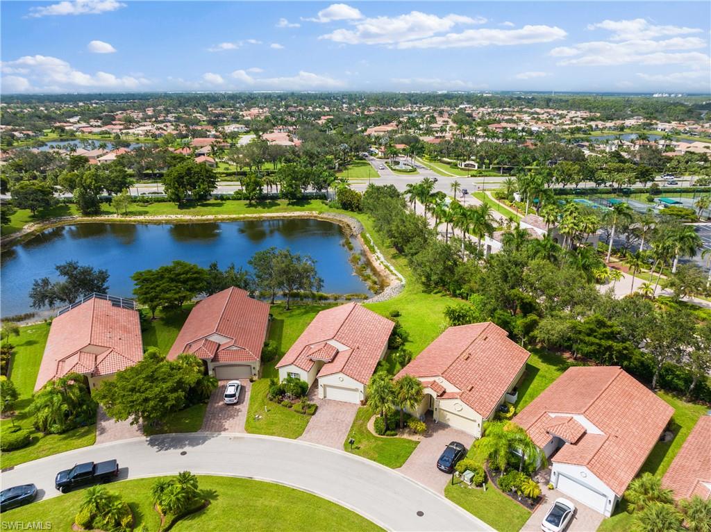 9300 Springview Loop Estero, FL 33928 - Photo 42 of 50 an aerial view of residential houses with outdoor space lake view and mountain view in back
