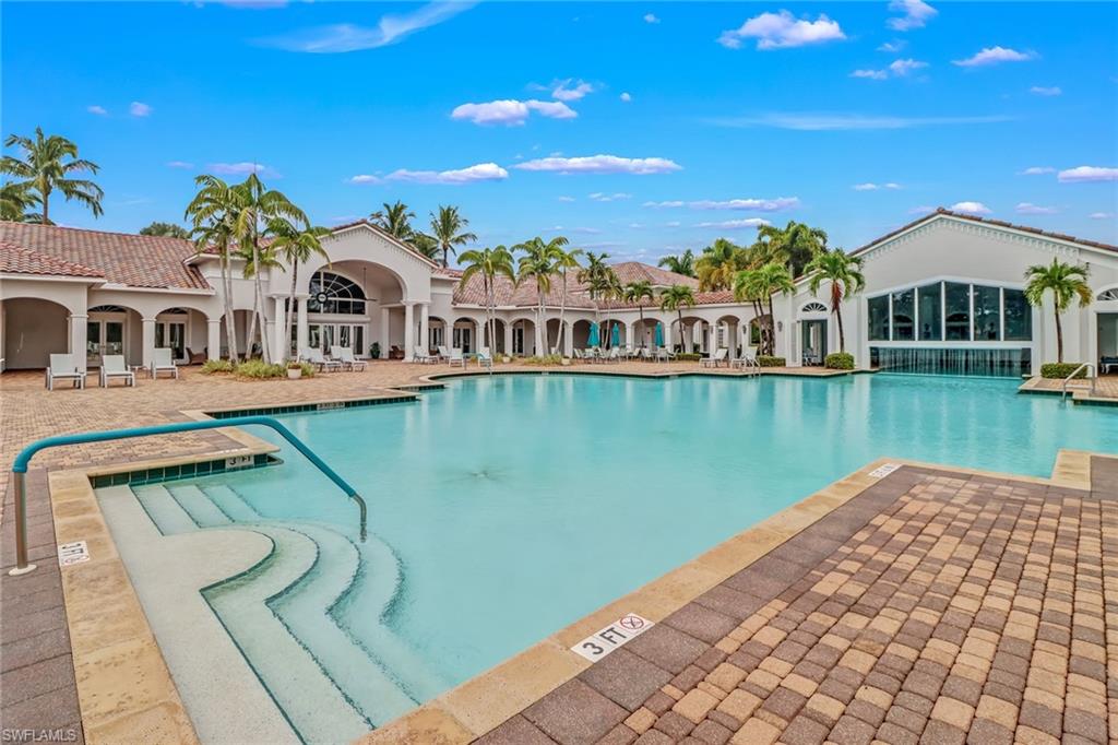 9300 Springview Loop Estero, FL 33928 - Photo 46 of 50 a view of a lake with a house in the background