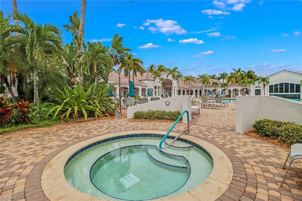 9300 Springview Loop Estero, FL 33928 - Photo 48 of 50 a swimming pool with outdoor seating and yard
