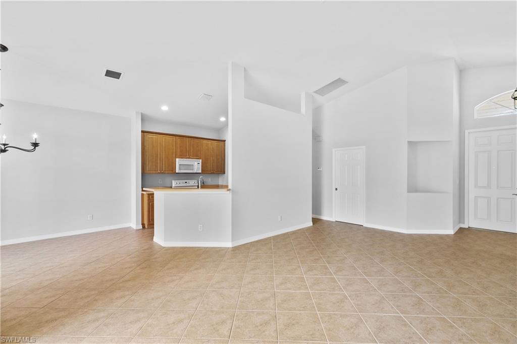 9300 Springview Loop Estero, FL 33928 - Photo 8 of 50 a view of a big room with windows and yard