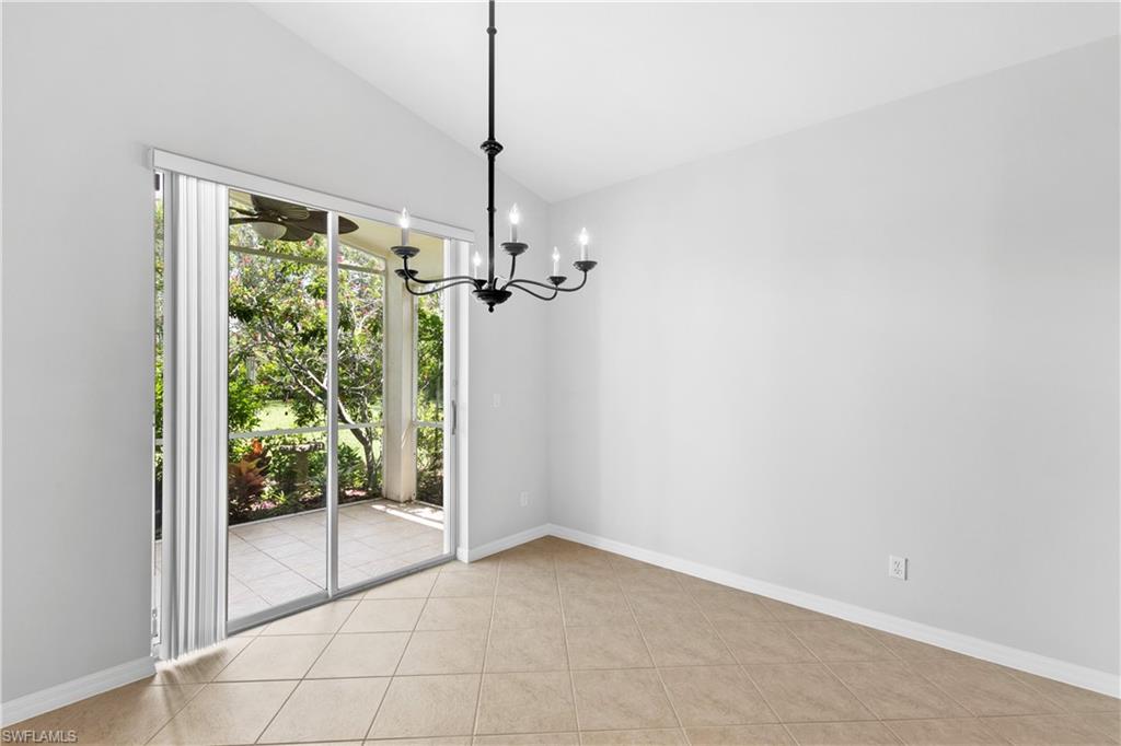 9300 Springview Loop Estero, FL 33928 - Photo 9 of 50 a view of empty room with floor to ceiling window