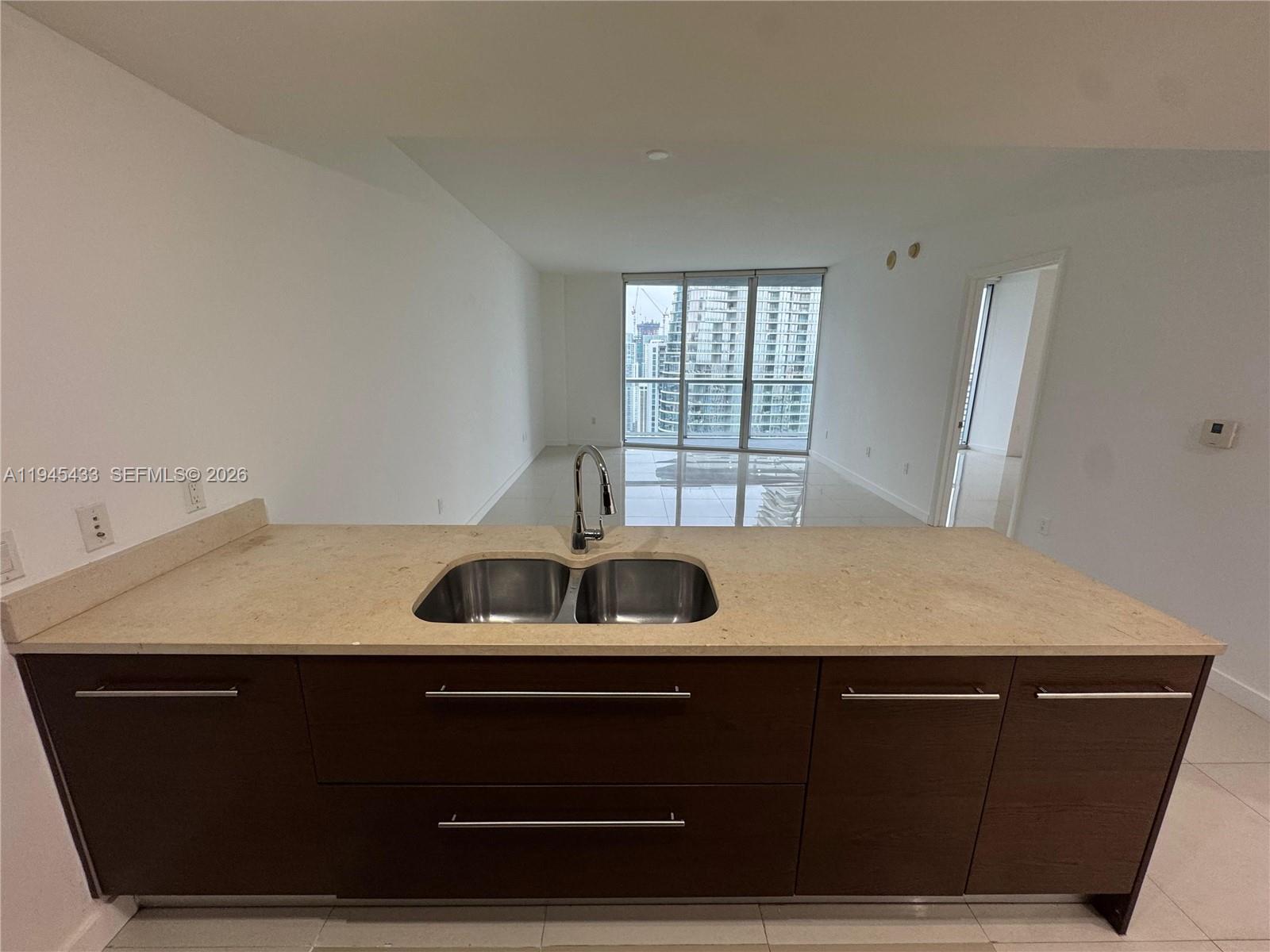 475 Brickell Avenue, Unit 4512 Miami, FL 33131 - Photo 12 of 32 a room with a sink and a cabinet