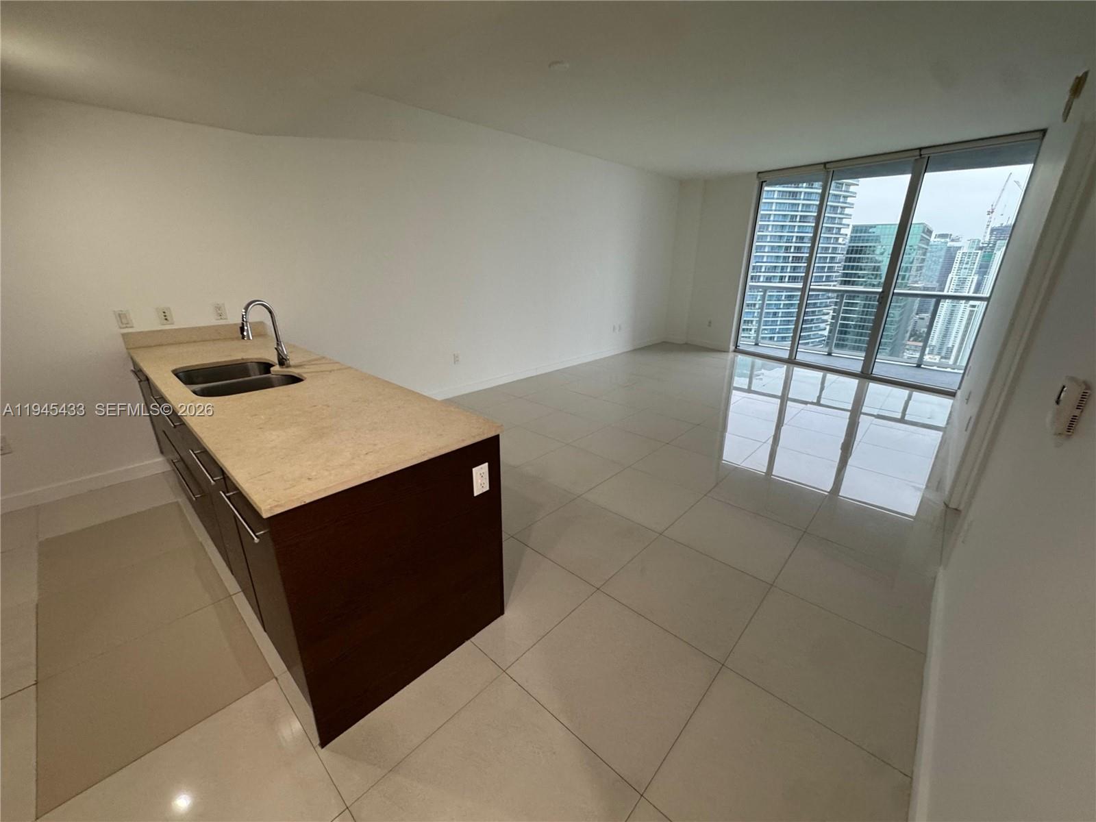475 Brickell Avenue, Unit 4512 Miami, FL 33131 - Photo 14 of 32 a utility room with a sink a vanity and window