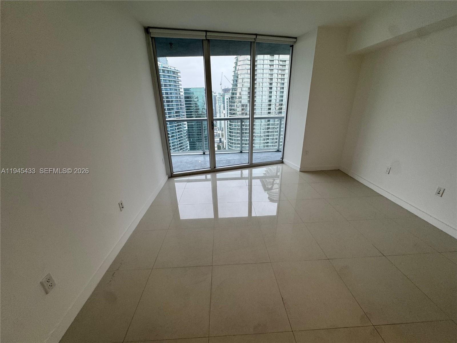 475 Brickell Avenue, Unit 4512 Miami, FL 33131 - Photo 19 of 32 a view of an empty room with a window