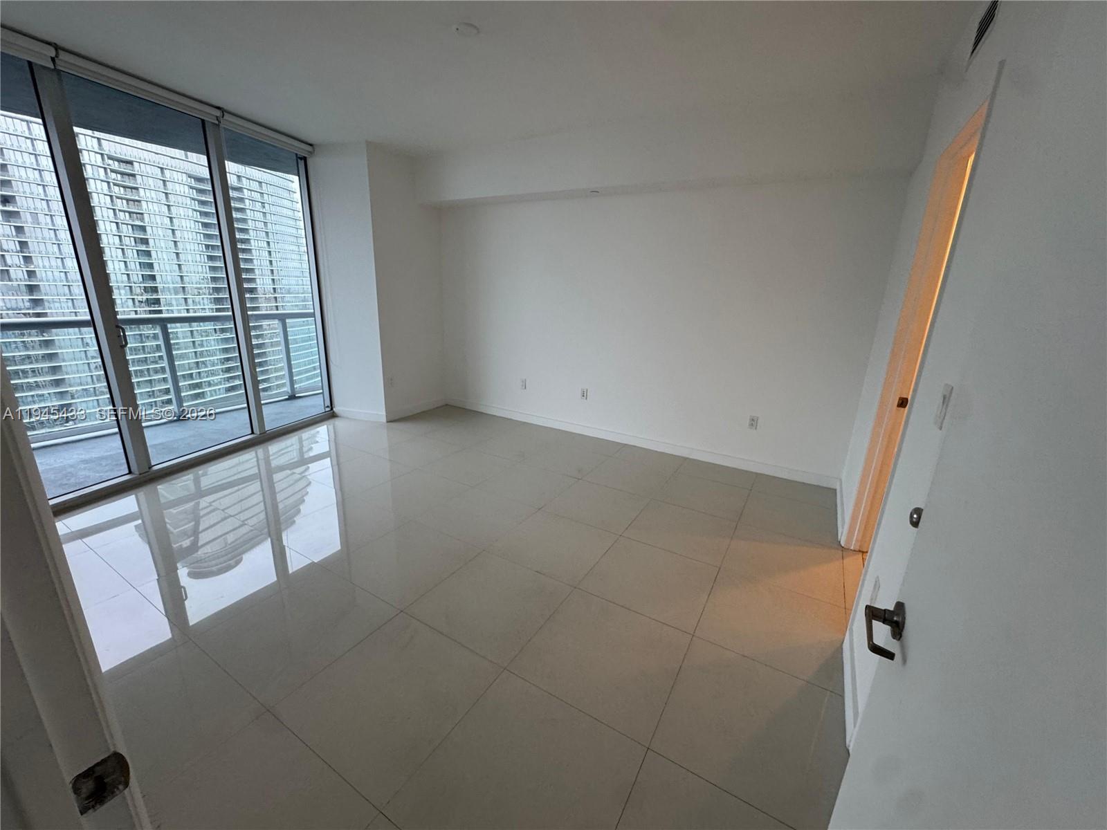 475 Brickell Avenue, Unit 4512 Miami, FL 33131 - Photo 22 of 32 an empty room with windows
