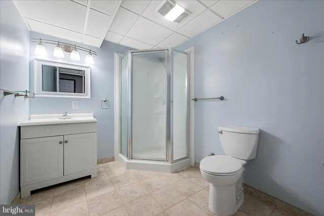 a view of house with roof deck and entertaining space