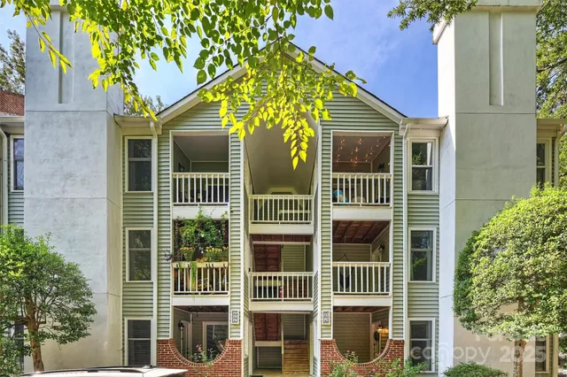 a front view of a house with a large window