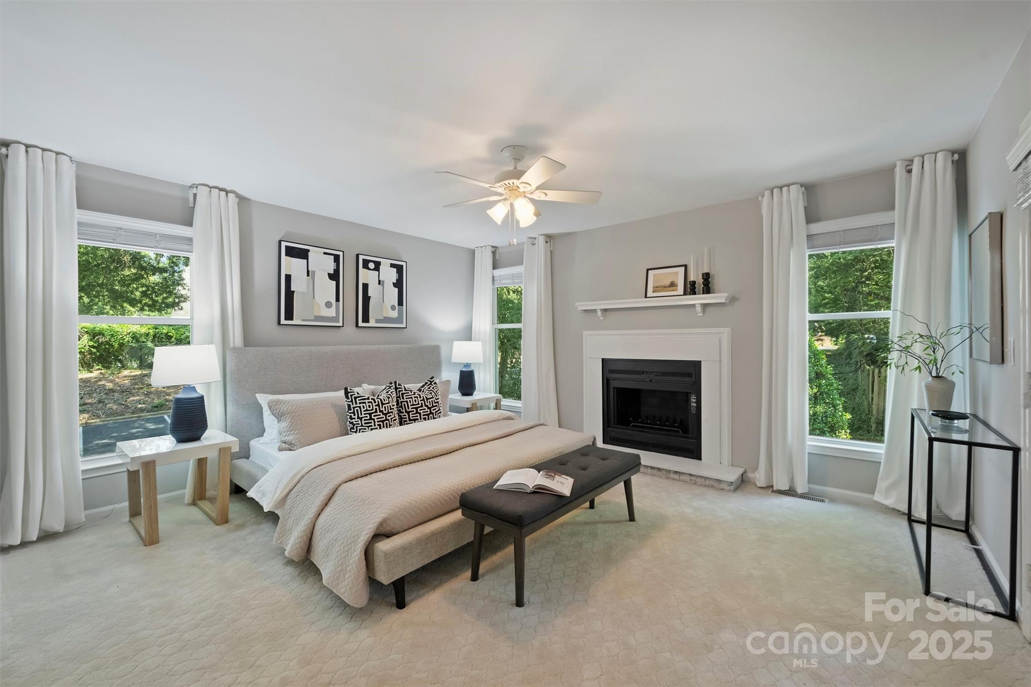 430 Queens Road, Unit 712 Charlotte, NC 28204 - Photo 28 of 43 a bedroom with a large bed and a fireplace