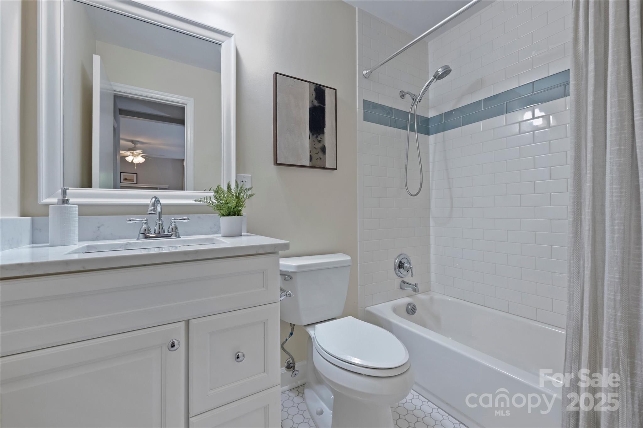 430 Queens Road, Unit 712 Charlotte, NC 28204 - Photo 29 of 43 a bathroom with a sink a toilet and shower