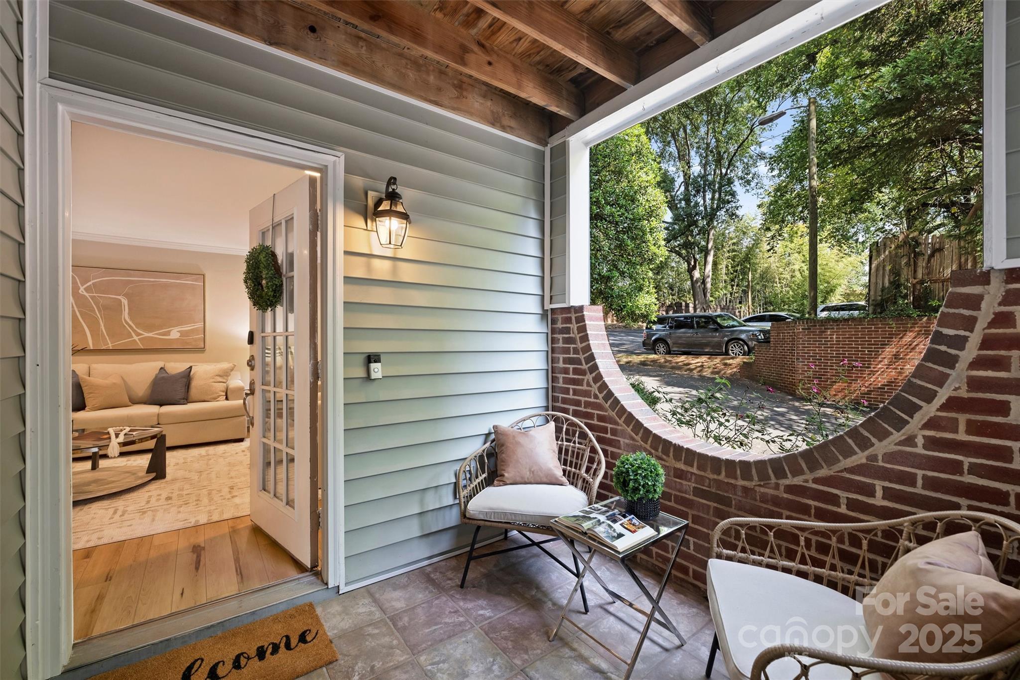 430 Queens Road, Unit 712 Charlotte, NC 28204 - Photo 3 of 43 a view of a patio with chair and tables back yard of the house